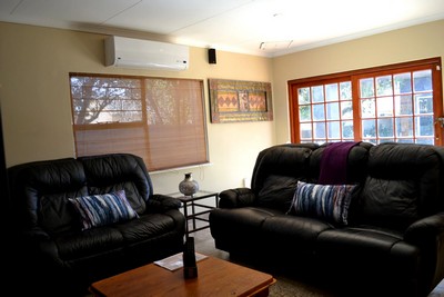 Two bedroom self catering unit lounge with big screen & DStv